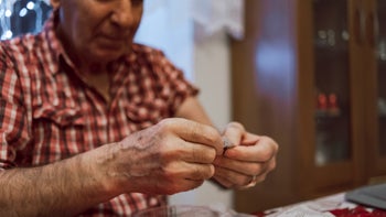 Senior Health: senior man taking medication 1469526448