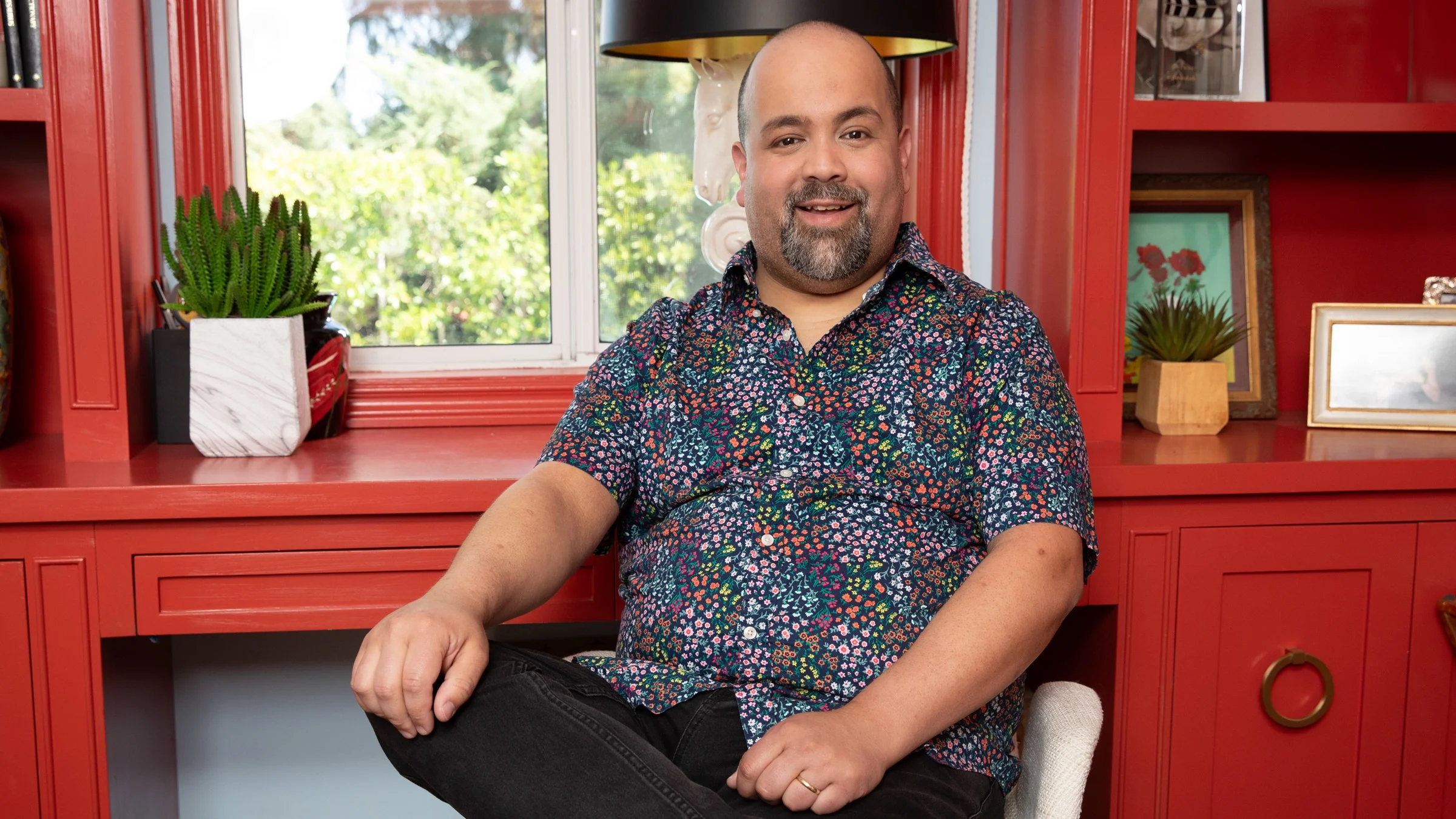 Christian Carrion is pictured in a snapshot, smiling.