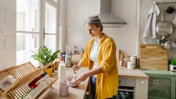 Gut Health: Diet Nutrition: woman making oatmeal 1357676778