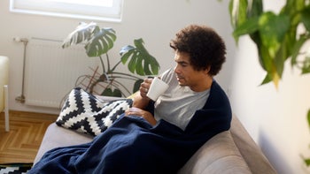 Health: Cold symptoms: man with cold drinking tea 1436691772