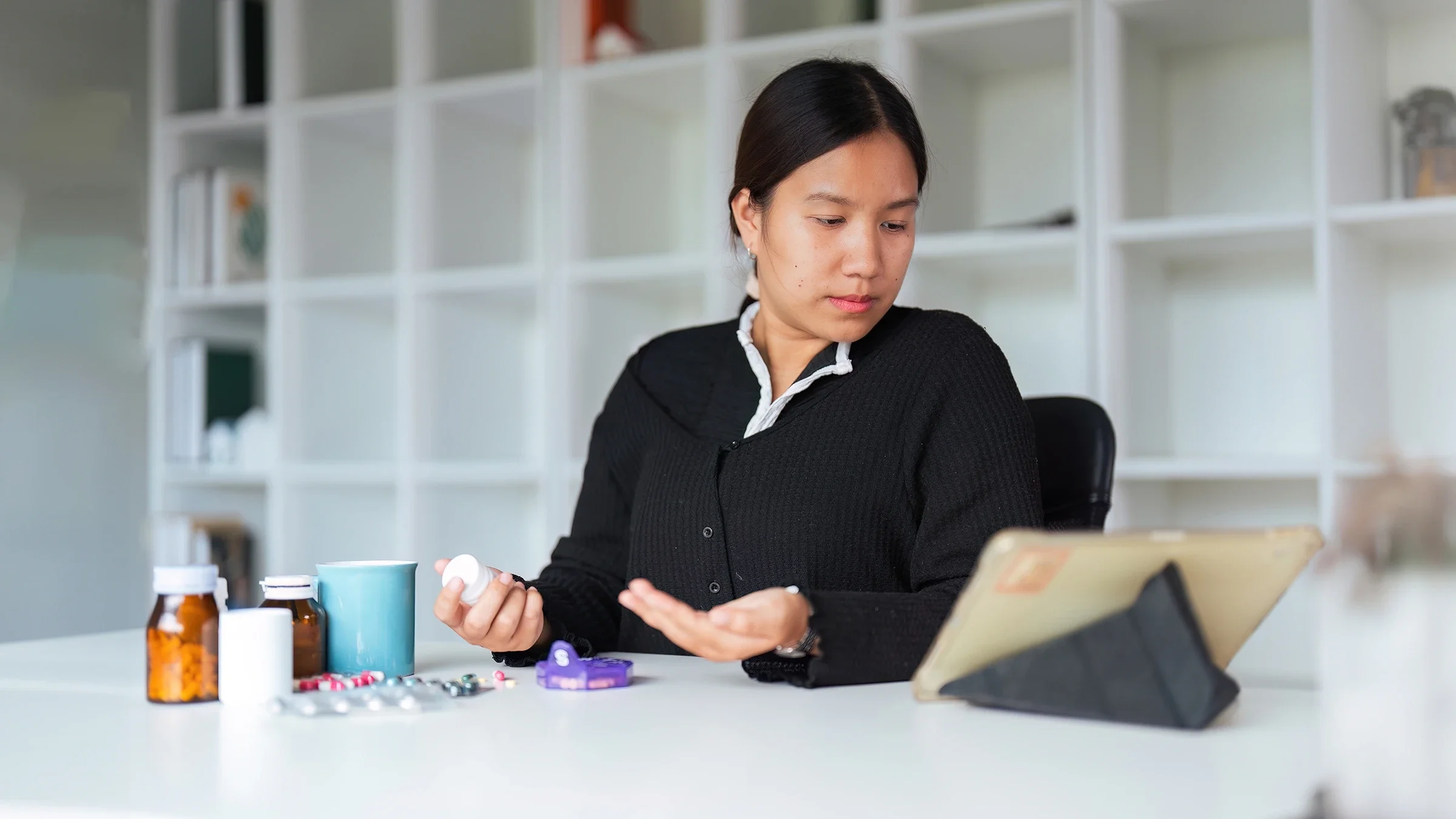 A woman does research on her medication.