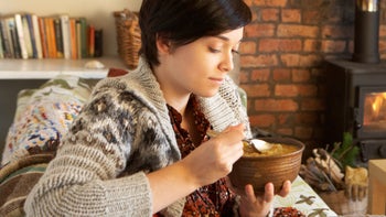 Diet Nutrition: woman eating soup 1147152535