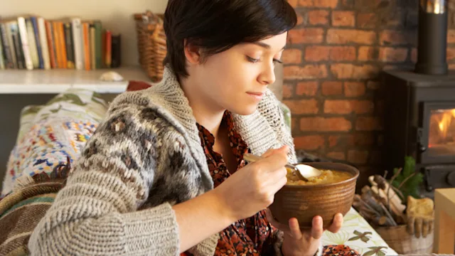 Diet Nutrition: woman eating soup 1147152535