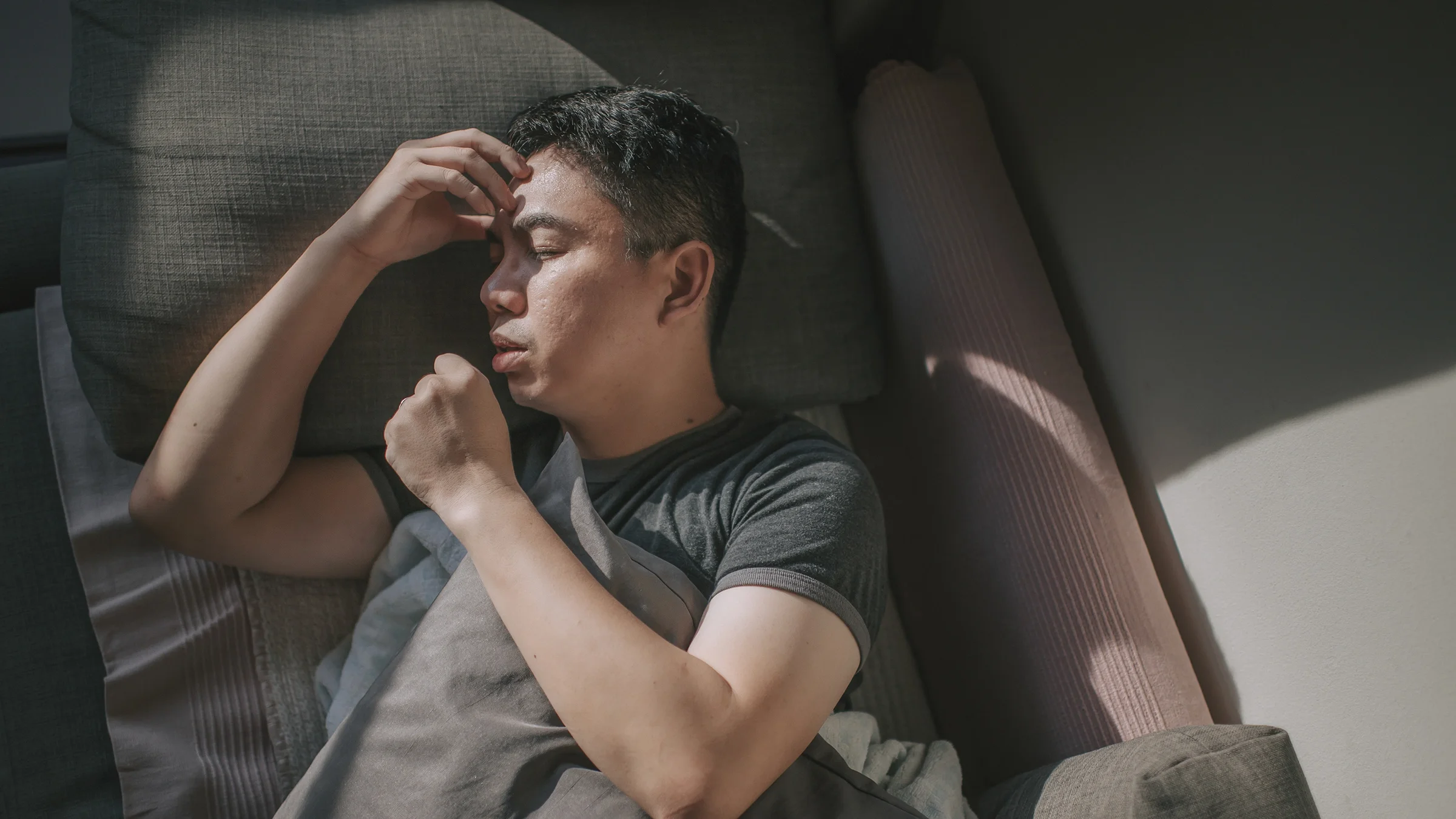 Man sleeping in bed.