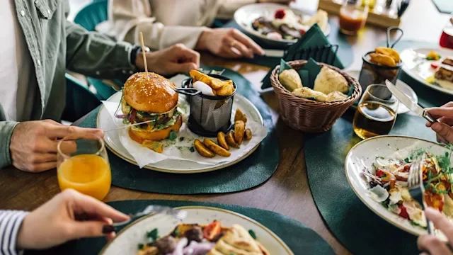 diet-nutrition: group eating out at restaurant 2182895995