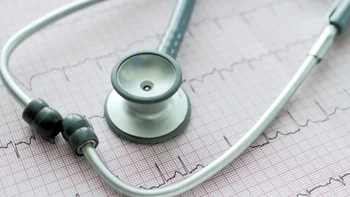 Atrial fibrillation: close up stethoscope ECG 473291878