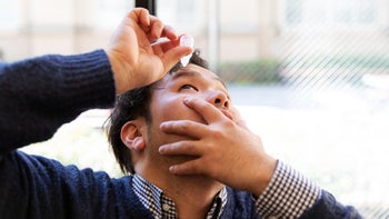 eye: man using eye drops 1138797462