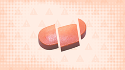 Red-orange background with texture and warning sign pattern. In the center is an oblong orange-ish pill cut into thirds. 
GoodRx Health