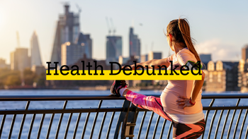 pregnant woman stretching after run near city-1061673680
