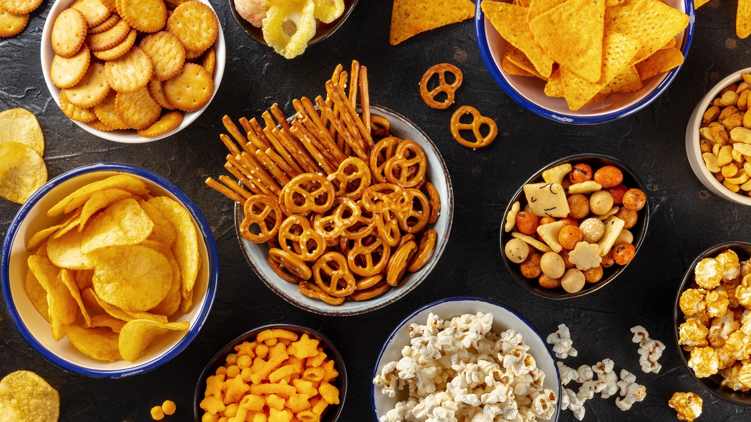 Salty snacks are displayed on a table.