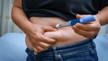 GLP-1: closeup stomach injection 2236560849