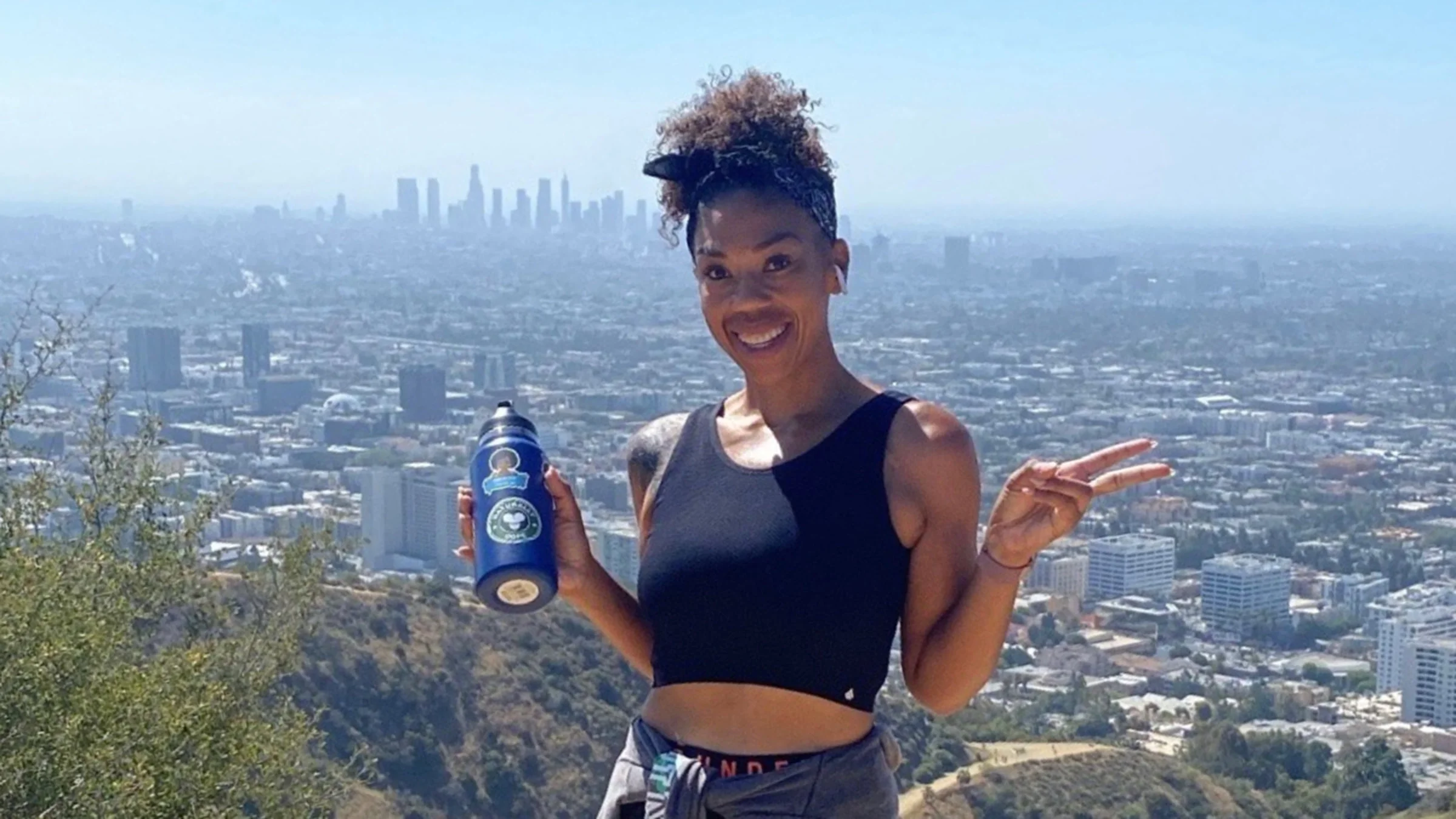 Marilyn Pool is pictured hiking, with Los Angeles in the background.