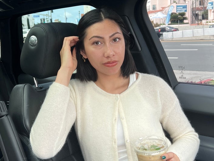 Stacey Asis is pictured in her car. 