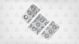 Light gray background with texture and warning sign pattern. In the center is a silver blister pack of pills cut into thirds.  
GoodRx Health