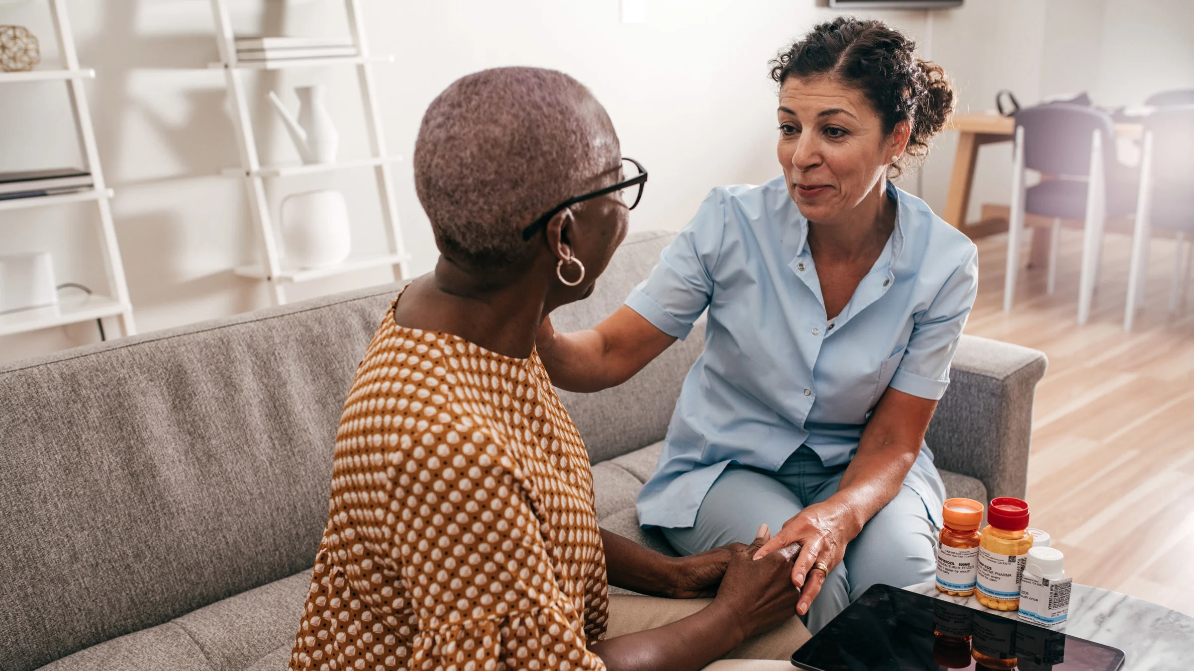 A nurse explaining medications to a patient.