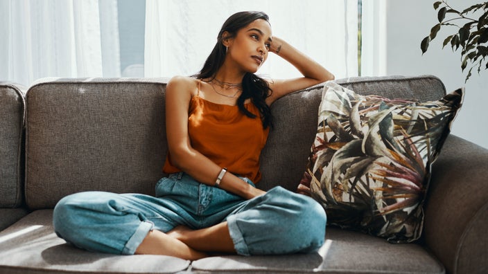 Woman relaxing on sofa.