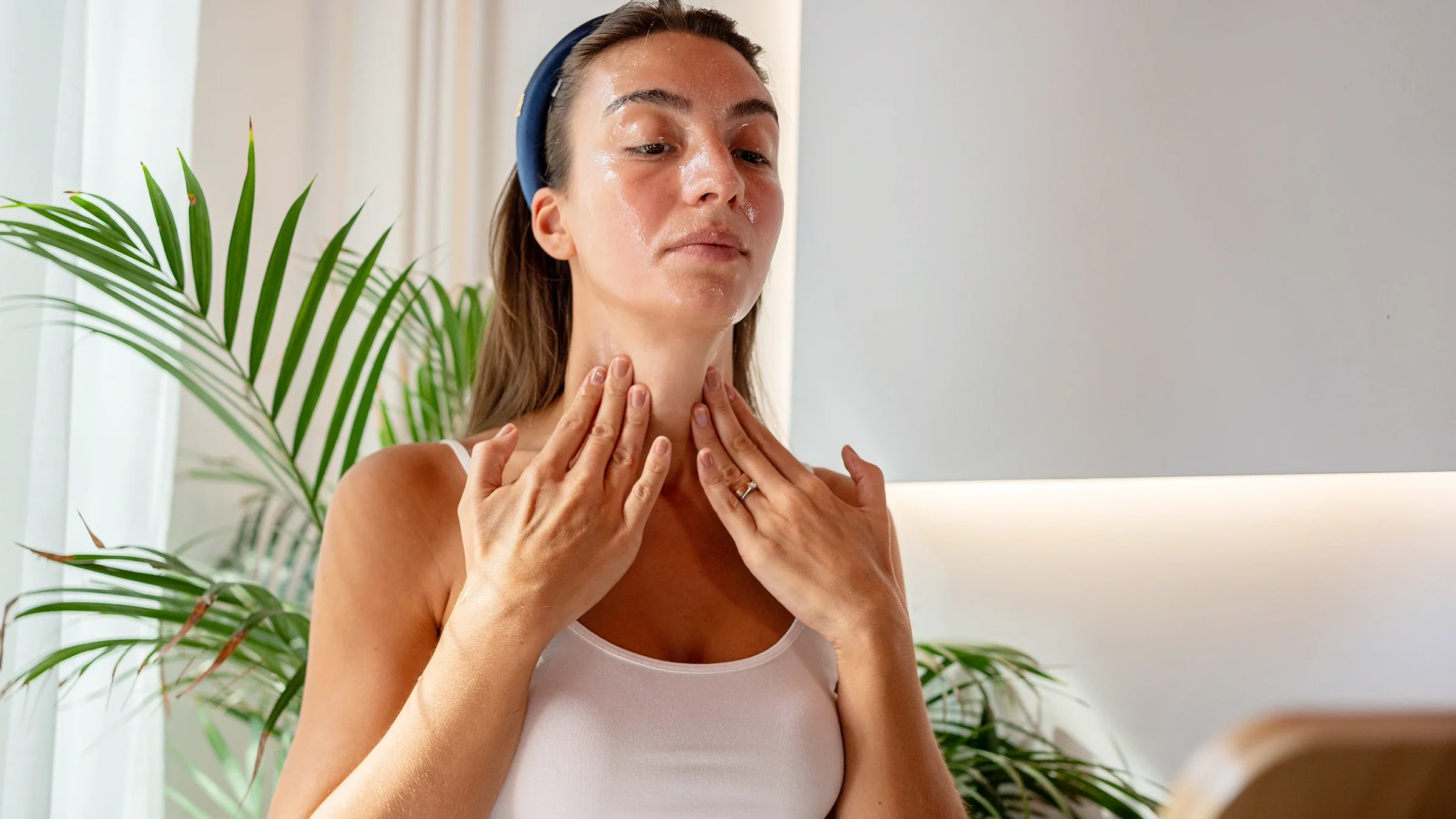 Woman applying facial serum