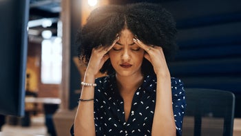 Wellbutrin: Side effects: woman with headache 1131983411