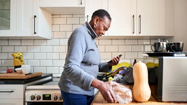 Arthritis: senior woman unpacking groceries 1303288426