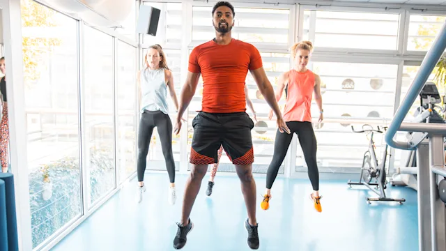 movement-exercise: group doing burpee exercise 1197919359