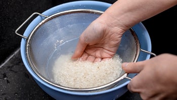 Diet Nutrition: closeup straining rice water 2154825514