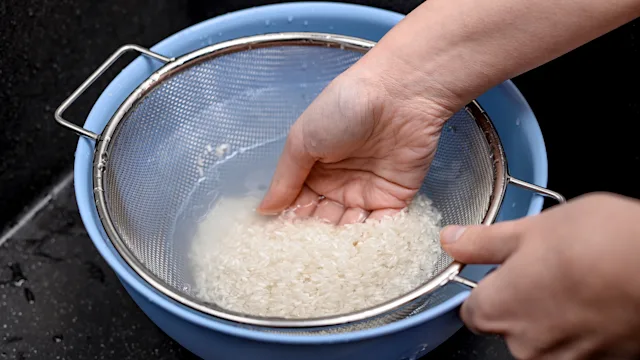 Diet Nutrition: closeup straining rice water 2154825514