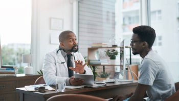 Health: Mens health: doctor explaining to patient 1390000448