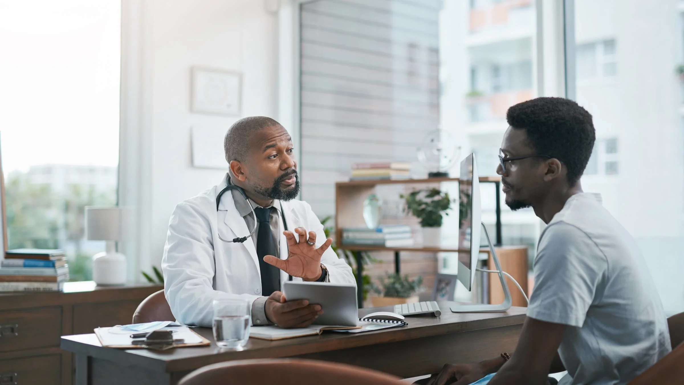 A man is at a medical appointment. There are several reasons for low sperm count, including injuries and infections.  