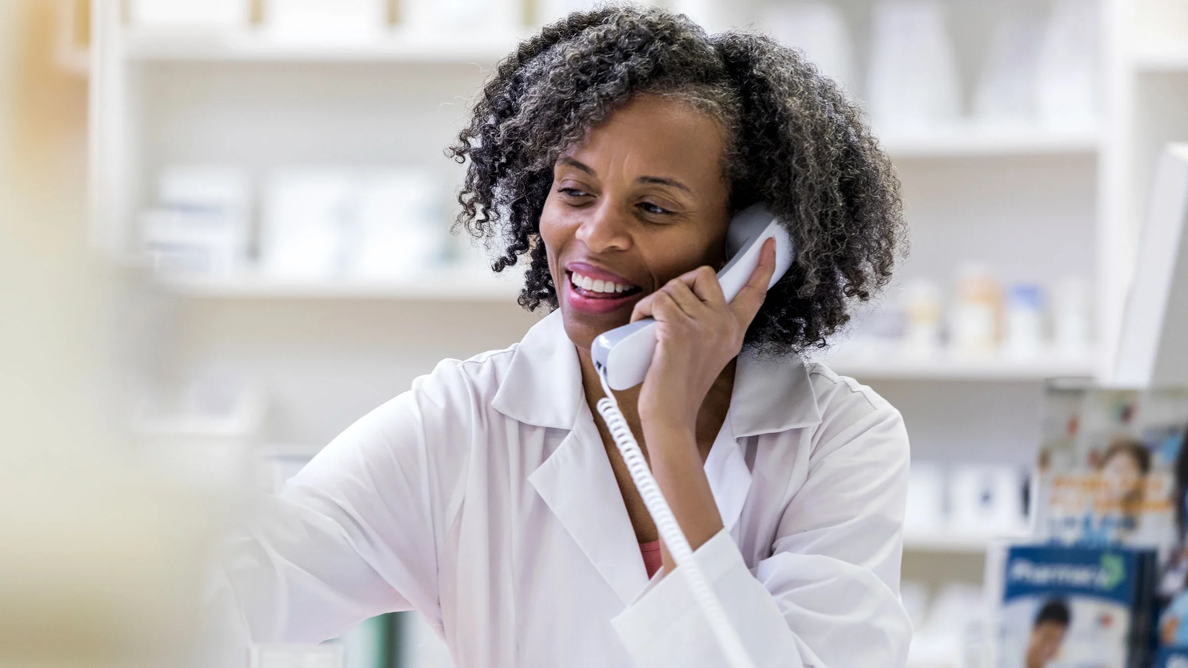 Pharmacist speaking on the phone