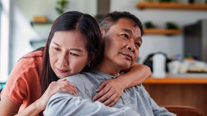 Woman expressing empathy toward a man