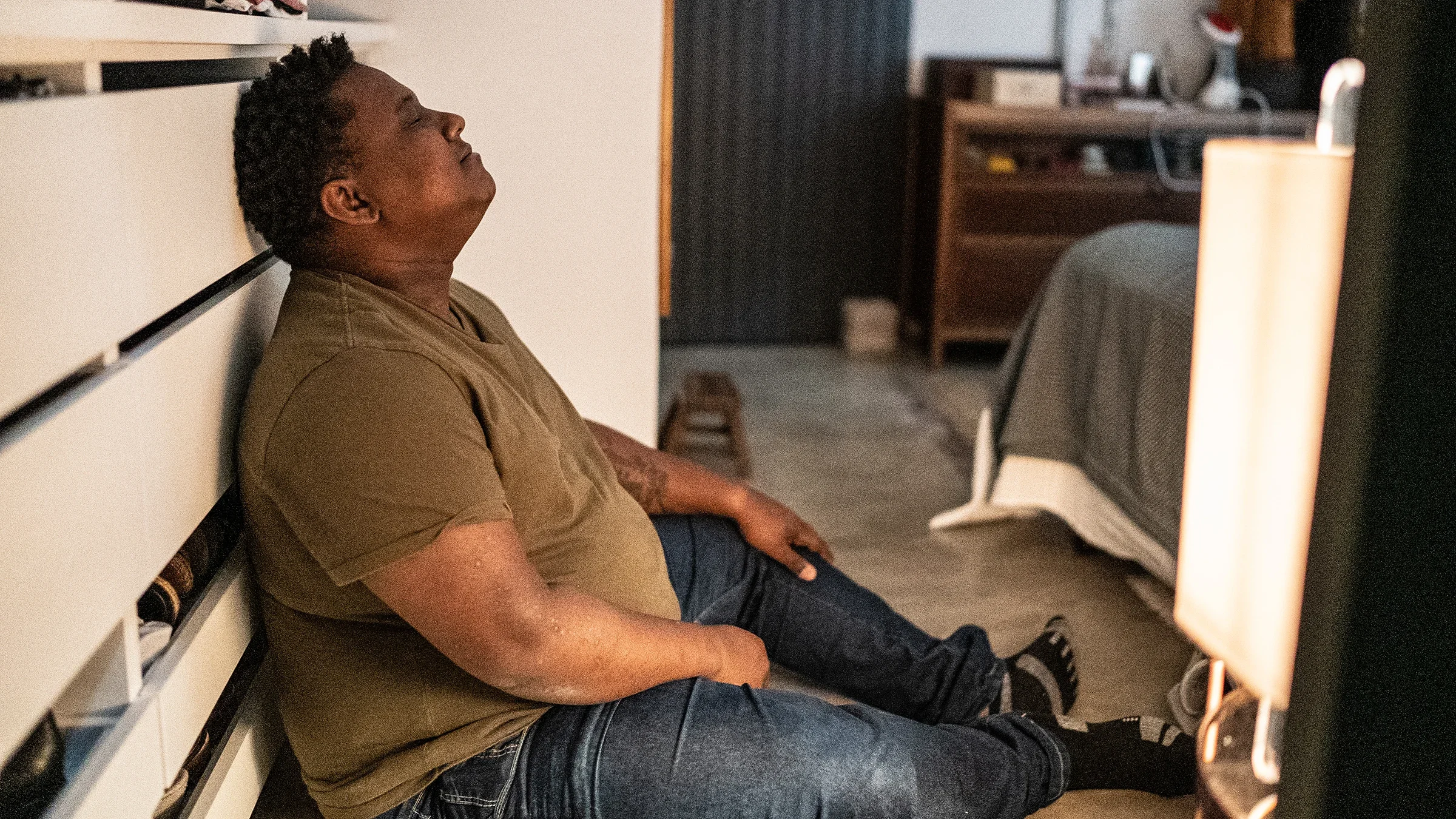 A man sits on the floor with his eyes closed. 
FG Trade/E+ via Getty Images