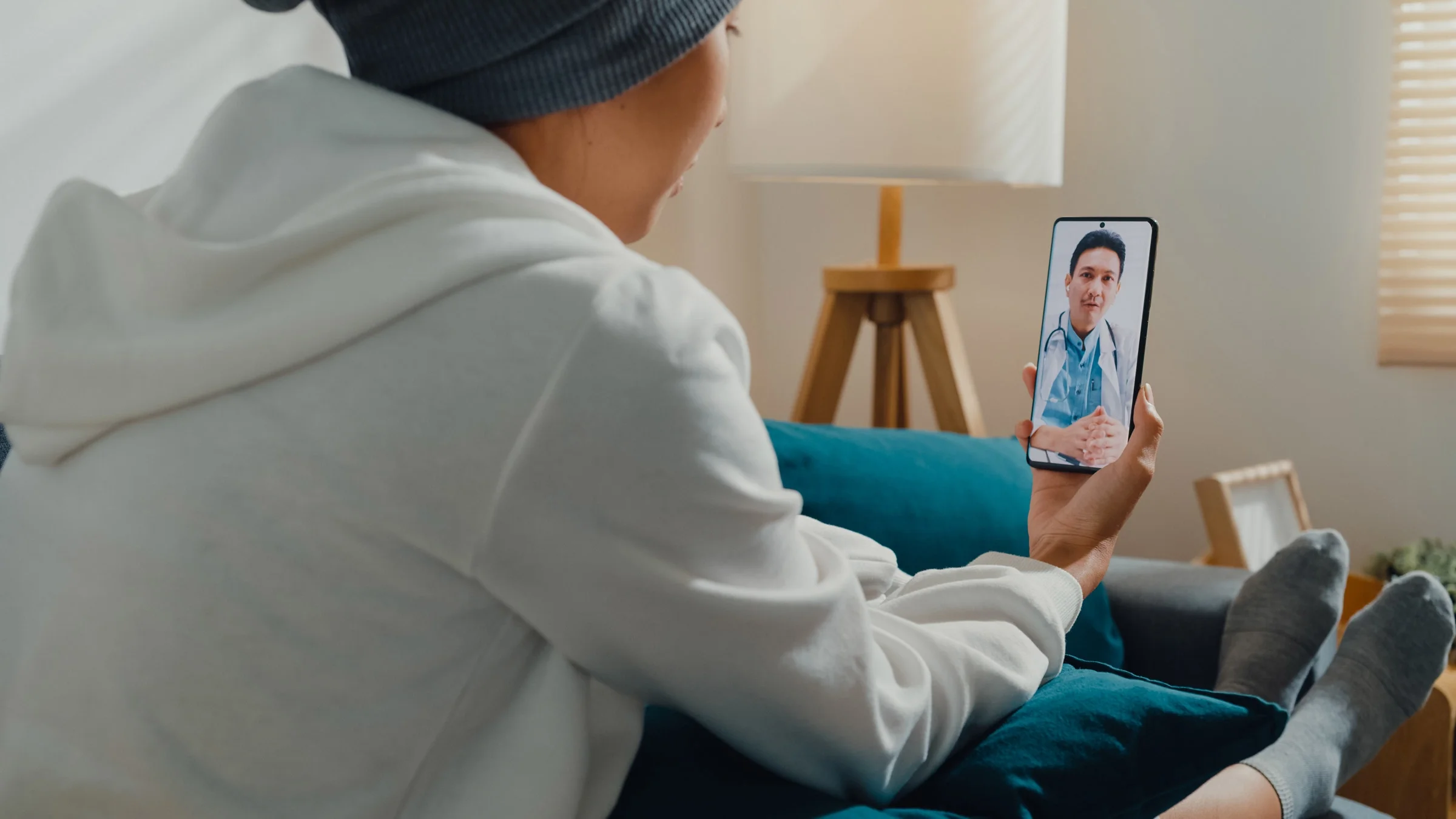 A cancer patient discussing treatment with their doctor in a telehealth call.