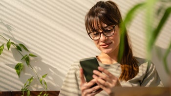 Substance use disorder: App: leaning against wall on phone 1356938545