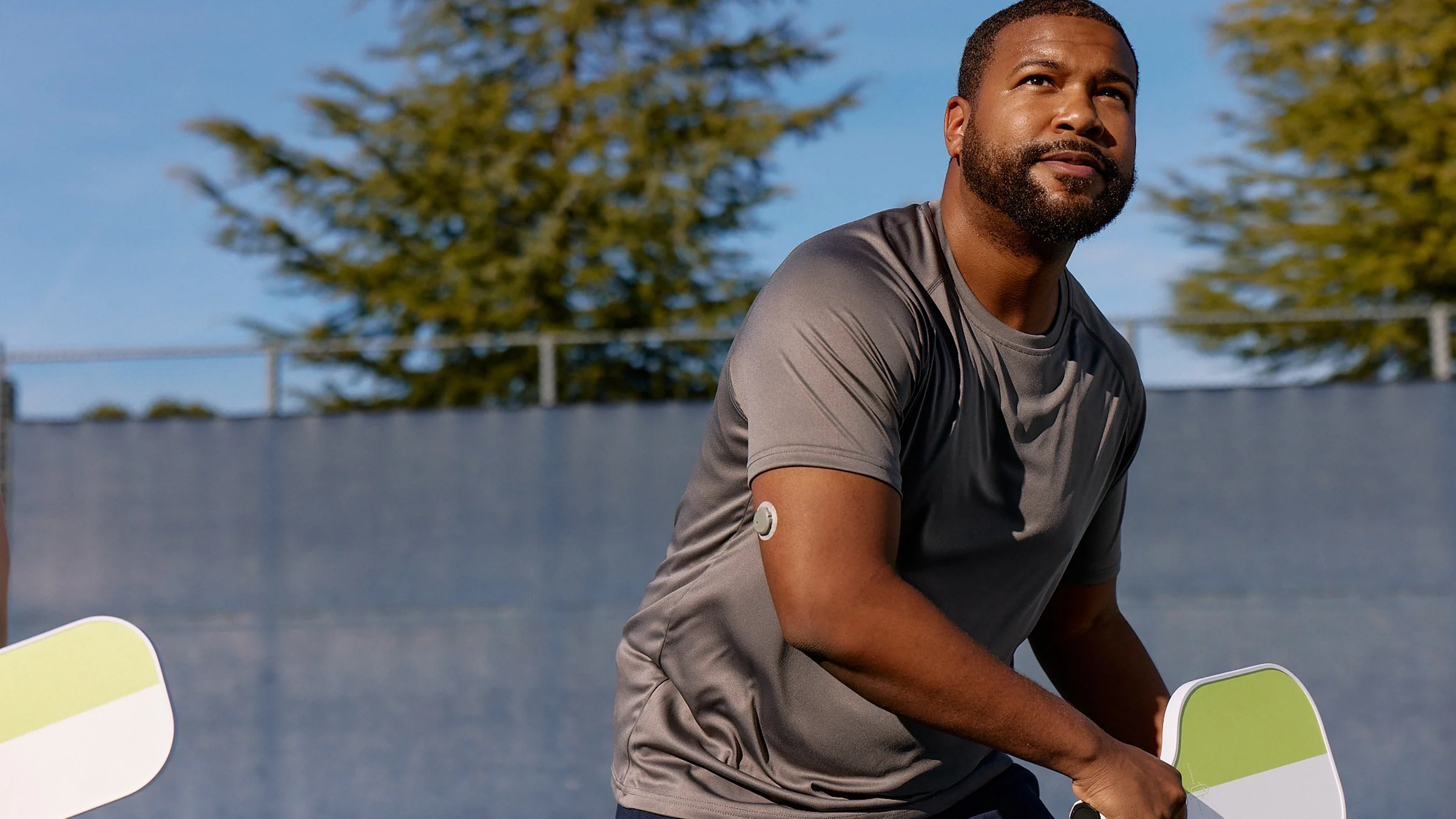 Man playing pickleball wearing Dexcom’s Stelo Glucose Biosensor System