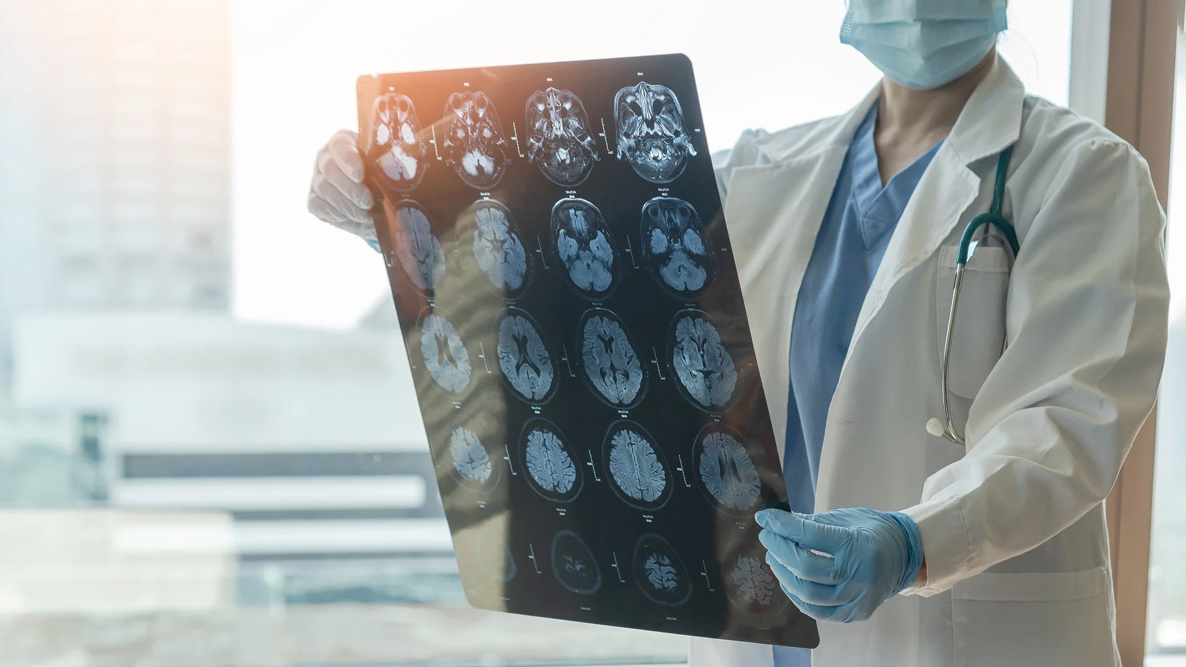Cropped shot of a doctor reviewing brain scans.
Credit: Chinnapong/iStock via Getty Images
