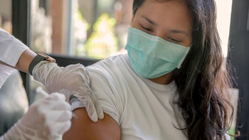 Health: Hepatitis B: closeup woman getting a shot-1321603204