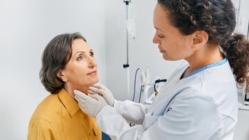 Health: Thyroid: doctor checks thyroid 1326326607