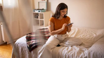 metformin: diabetic person researching on phone 1871110404