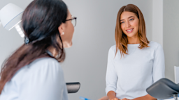 Young woman with straight hair consulting with their doctor at an appointment.
Inside Creative House/iStock via Getty Images