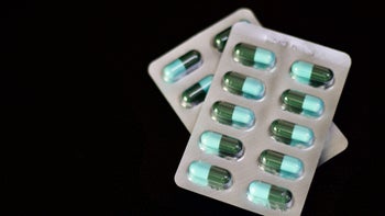 Amoxicillin: blister packs of medication blue and green pills 1187751232