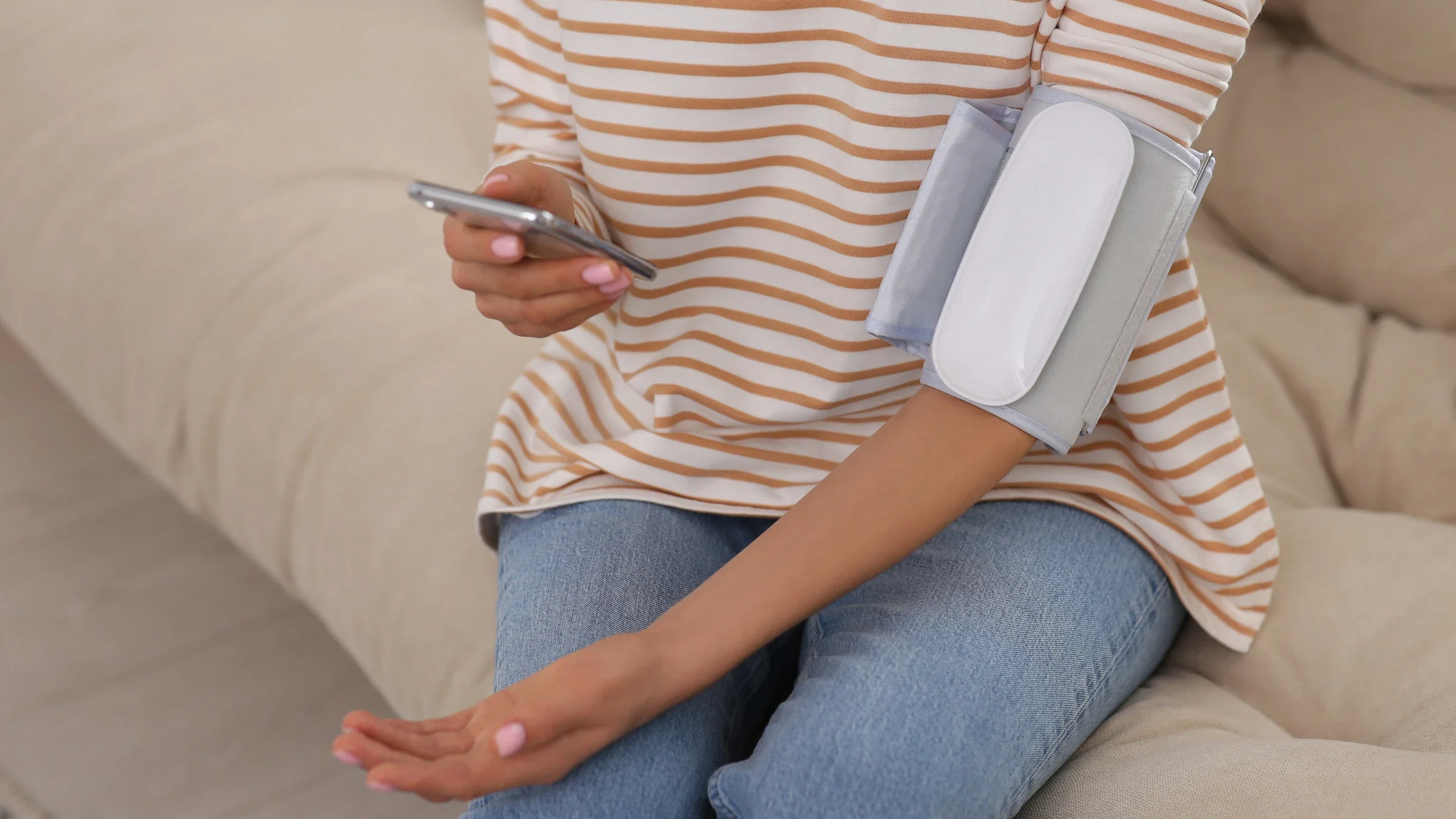 A person checking their blood pressure using their phone.
Liudmila Chernetska/iStock via Getty Images Plus 