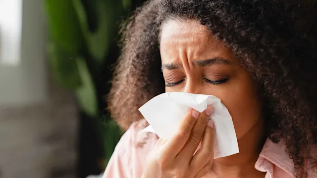 Health: Enbrel: woman blowing nose 1364075617