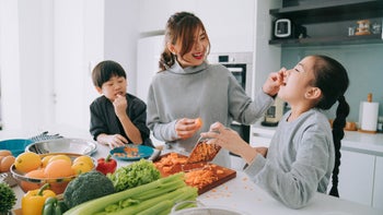 Health: Eye: mother feeding child carrots 1337364354