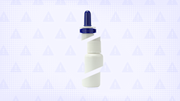 A nasal spray bottle with a blue cap is in the center of a light blue-purple background with texture and a warning sign pattern.
GoodRx Health