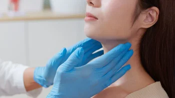 Hyperthyroidism: closeup thyroid checkup 2243450843