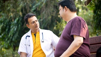 Weight loss: Saxenda: doctor talking to patient outside 1194116747