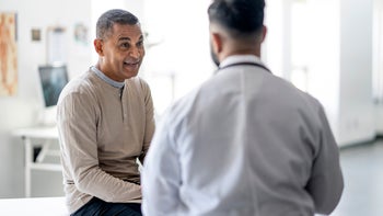 Parkinson's Disease: senior man at medical appointment 1442556608