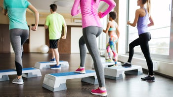 Health: Movement and exercise: backview step aerobics class 488715884
