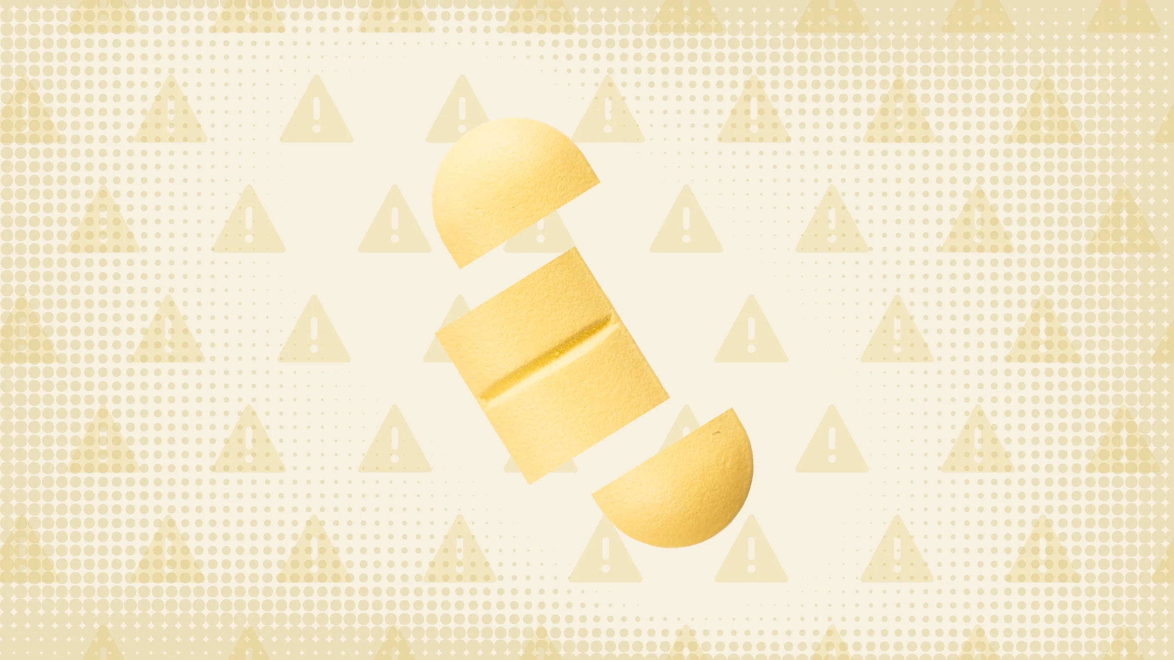 In the center of a light yellow-orange background with texture and warning sign pattern is a yellow oblong pill cut into thirds. 