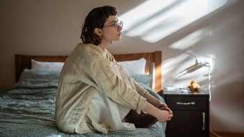 Womens health: woman sitting alone with her thoughts 2130689337